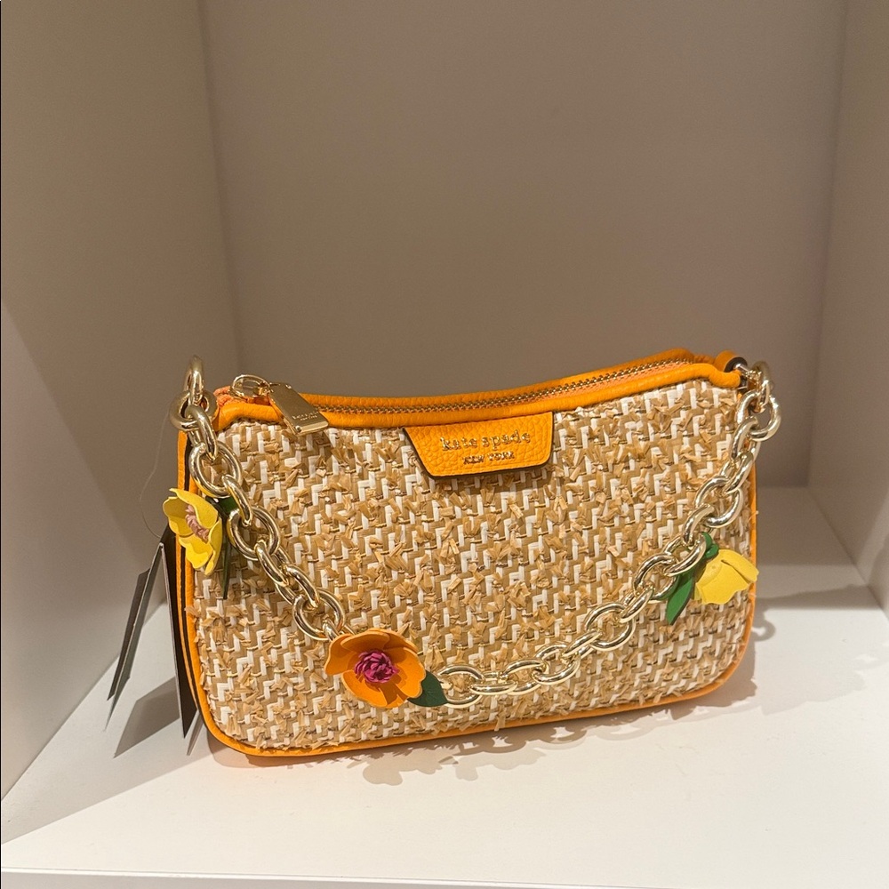 kate spade woven straw clutch with yellow trim and floral accents
